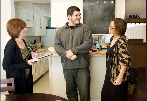 Beth Phillips meeting with wounded veteran Michael Ortiz and his wife April in their home