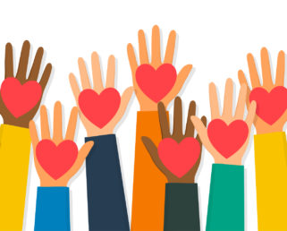 Diverse hands holding red hearts in the air